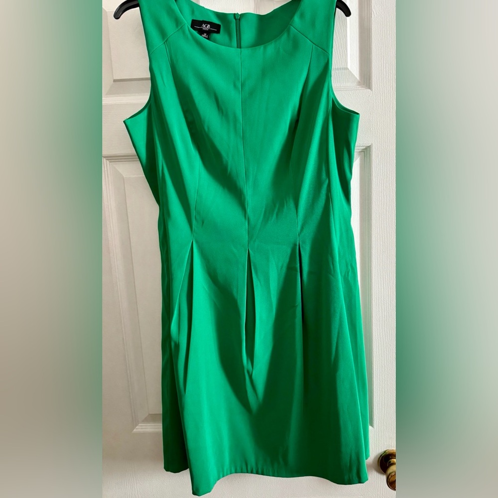 AGB green dress size 14 in ladies has beautiful front pleats year-round fabric.